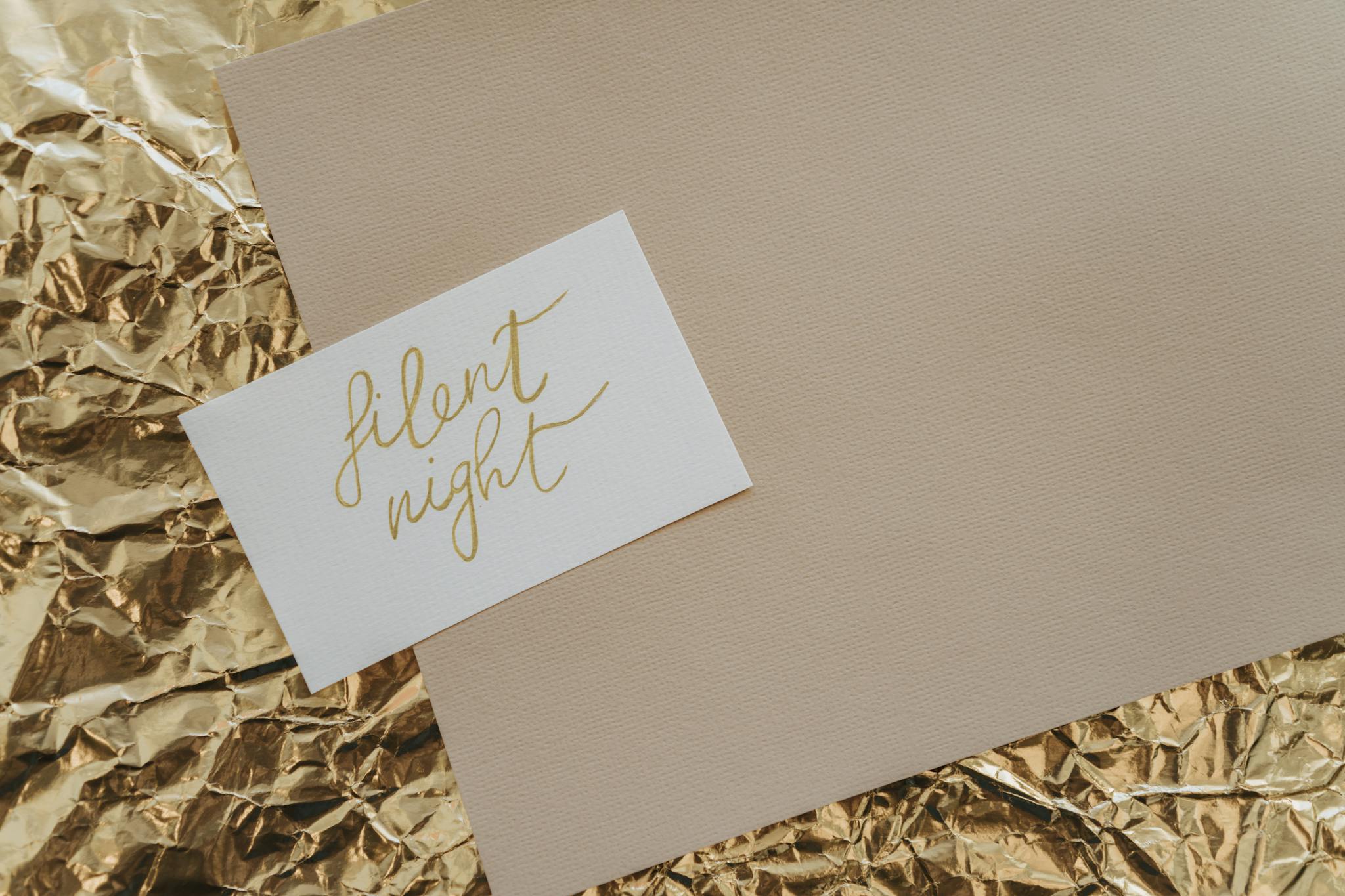 Elegant Silent Night card on a gold foil background, perfect for festive greetings.